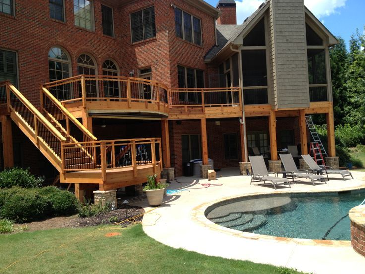 Custom Deck with Pool by Sugar Hill Outdoors