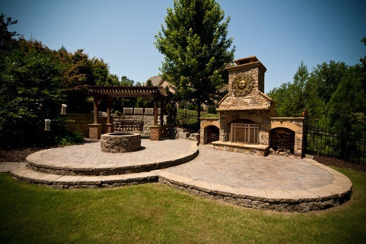 Outdoor Living Space with Fireplace, Firepit and Swing by Sugar Hill Outdoors