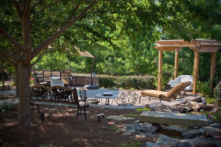 Outdoor Living Space with Pergola Swing by Sugar Hill Outdoors
