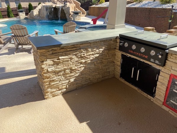 Blackstone Grill Installation by a Pool by Sugar Hill Outdoors