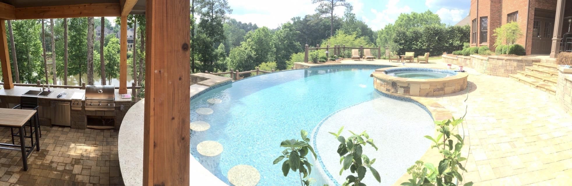 Pool with Swim Up Bar and Patio by Sugar Hill Outdoors